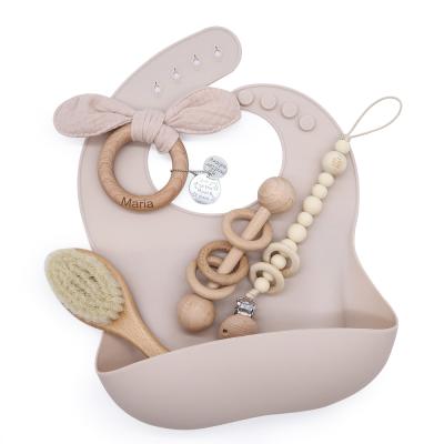 China Natural Logo Feeding Bib Set Baby Teething Milestone Rattle Custom Gift Wooden Toys for sale