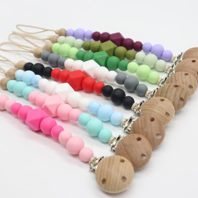 China BPA Free Wholesale Food Grade Beads Dummy Holder Silicone Pacifier Chain With Wooden Clip for sale