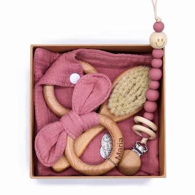 China Baby 100% Natural Cotton Infant Feeding Pacifier Holder Wooden Teether Ring Baby Shower Gift Set for sale