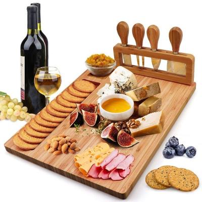 China Amazon Sustainable Hot Custom Wooden Bamboo Cheese Board Set With Cutlery In Slide Out Drawer Cheese Tray Cutting Board for sale