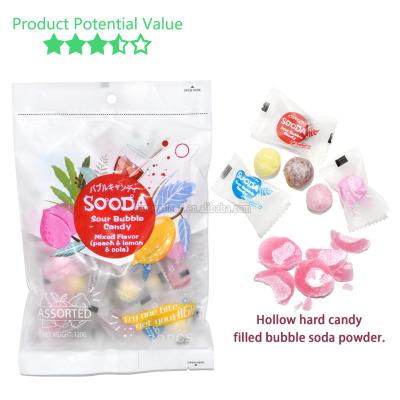 China Sour Soda Soda Bubble Powder Cavity Hard Candy Sour Ash Candy Natural Fruity Flavor Filled Soda Lemon Peach Caramel for sale