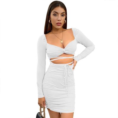 China Custom Anti-wrinkle Women Club Sexy V-Neck Bottom Cut Out Long Sleeve Crop Hip Skirt Top Pleated Two Piece Set for sale