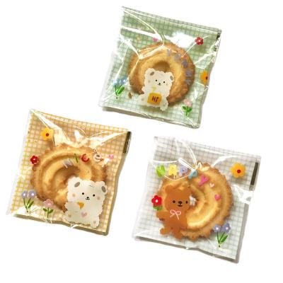 China Self-adhesive Seal Wholesale Cartoon Cookie Candy Bag Plastic Opp Cookie Packaging Bag 7x7cm 100/Pack for sale