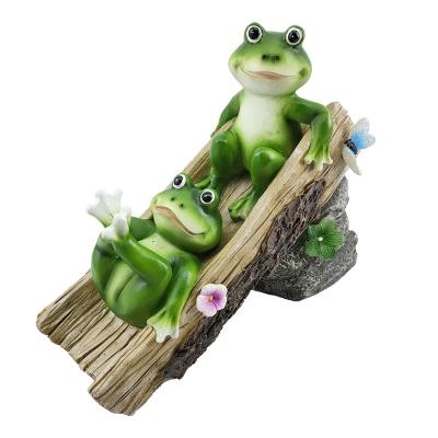 China Europe frog figurines decor resin frog playing solar slide lights crafts garden decoration statue for sale