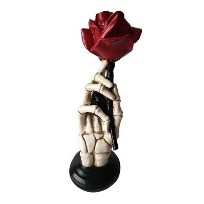 China Europe Resin Crafts Wholesale Resin Rose Flower Skulls Hand Garden Rose Flower Hand Statues for sale