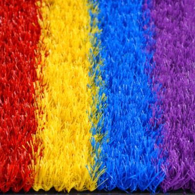 China Artificial Grass for Kindergarten Rainbow Artificial Grass Chinese Red Blue Yellow Color Purple Plant for Kindergarten for sale