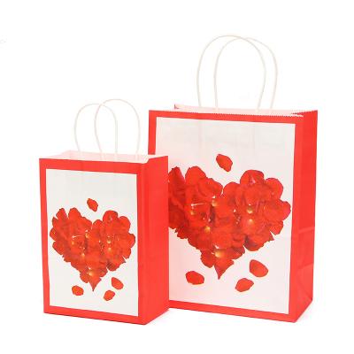 China Gift & Craft Maker Custom Printed Heart Pattern Petal Wrapping Paper Cardboard Flower Gift Paper Bag With Ribbon Handle for sale