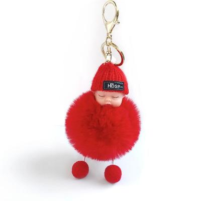 China Fashionable Girl Cute Acrylic Winter Keepsake Gift Cute Acrylic Baby Girl Sleep Doll Hat Lovely PVC Carrying Bag Accessories Keychain Pompom Metal for sale