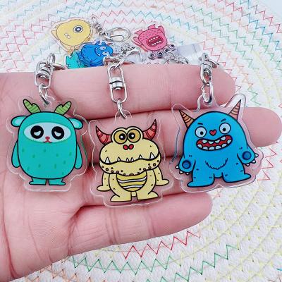 China Cute Children Schoolbag Monster Cartoon Key Chain Transparent Acrylic Pendants Trinkets Dressers for sale