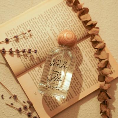 China Custom logo 30 ml 50ml 100ml crimp cosmetic luxury cylinder round wooden spray glass lid empty luxury 30ml perfume bottle with box for sale