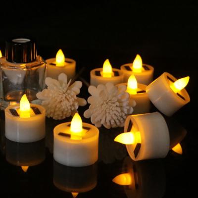 China Garden 12 Pieces Plastic Solar Energy Candle Yellow Light Power LED Flameless Electronic Tea Lights Lamp For Outdoor for sale