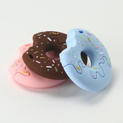 China Bring Joyful Custom Food Grade BPA Free Teething Chewing Toy Silicone Baby Teether Dangling Donuts for sale