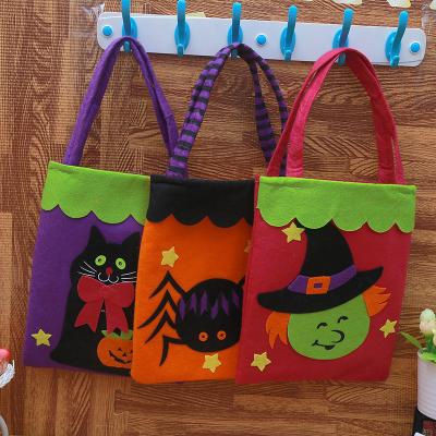 China 2022 Wholesale Cloth Halloween Supplies Pumpkin Bat Pattern Kids Halloween Candy Bag Non-woven Trick or Treat Bags for sale