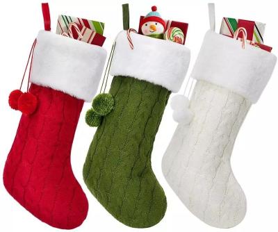 China Outdoor Christmas Decoration Kids Knitting Gift Thickened Solid Color Sock Santa Faux Fur Knitted Christmas Stocking With Pompom for sale