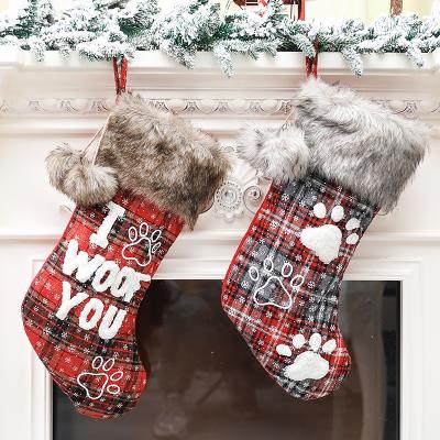 China 2022 Hot Sale Polyester Christmas Stocking Bangs Christmas With Ball Plaid Print Letter Dog Paw Candy Gift Bag For Home December Ornaments for sale