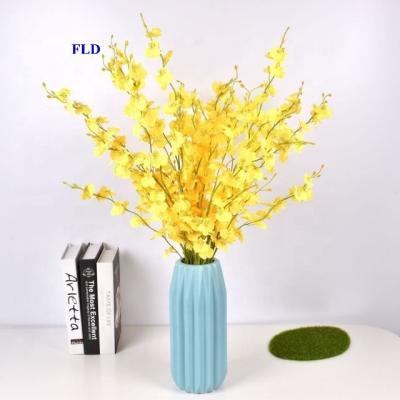 China Europe Fuleide Floral Decor Flowers Dancing Yellow Orchid 5Branches Artificial Flowers For Home Office Wedding Decoration for sale