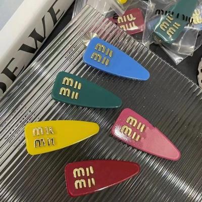 China Letters hair clip summer new hairpin candy color triangle hair clip side clip side blow acrylic European and American fashion beautiful for sale