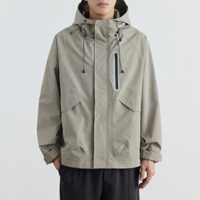 China The other new trend of 2023 autumn loose plus outdoor men's Gray Outdoor Hooded Rushing Jacket defense jacket three size for sale