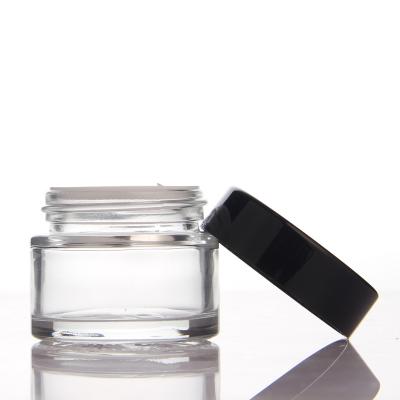 China Cosmetics and skin care packaging small capacity round glass eye cream cream skin care packaging jar 25g glass jar with free samples for sale