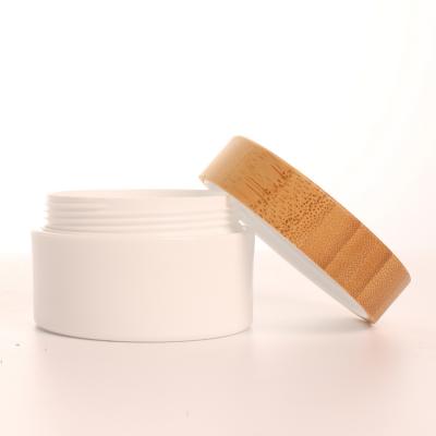 China Wholesale Personal Skin Care Packaging 100g Plastic Cream Container Engrave Logo Bamboo Lid pp Cream Jar For Baby Cream Packaging for sale