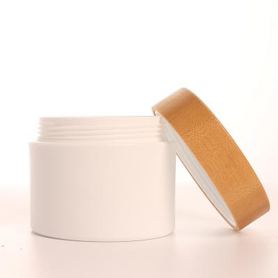 China Personal Cylinder Frost Empty Skin Care Packaging 150g Volume White PP Cream Packaging Container Baby Cream Lid Bamboo Bamboo Jar for sale