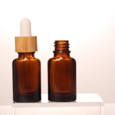 China Personal Hot Selling Bamboo Skin Care Packaging 10ml Luxury Style Drop Cap Cosmetics Essential Oil Eye Drop Bottle Packaging for sale