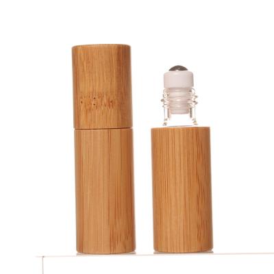 China Personal Packaging 5ml Mini Size Portable Travel Use Bamboo Cover Skin Care Glass Ball Roll On Lip Oil Container With Your Own Laser Logo for sale