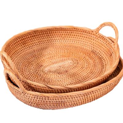 China Sustainable Round Basket With Handle Handwoven Rattan Tray Bread And Fruit Food Storage Basket Small/Middle/Large for sale