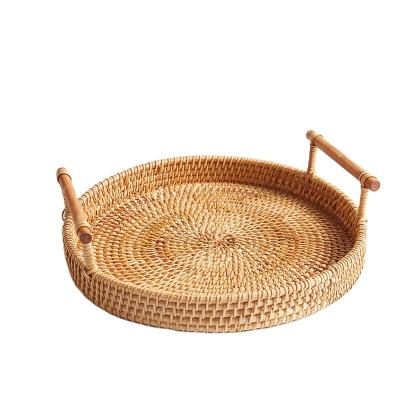 China Sustainable Handmade Handwoven Round Storage Tray Bread Basket Food Container Rattan Decorative Storage Baskets for sale