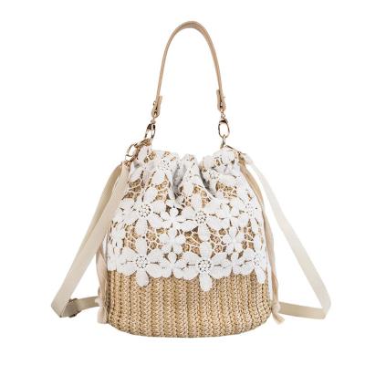 China 100% New 2020 Environmental Protection Bags Hollow Straw Seaside Holiday Handle Bucket Bag Spring Summer Beach Handmade Handbag for sale