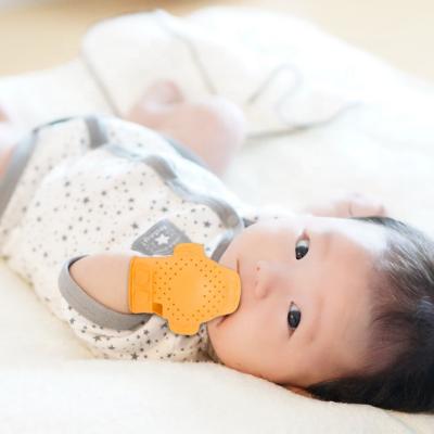 China New Launch Non-Toxic Food Grade Silicone Teether Glove , Teething Mitts For Babies for sale