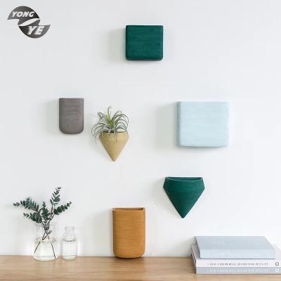 China Wall hung popular design home decoration western indoor elegant vase ornament various colors ceramic wall hung vase for sale