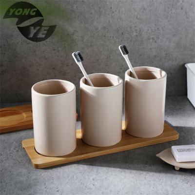 China Sustainable Ceramic Hotel Toilet Brush Holder Soap Dispenser Bath Set for sale