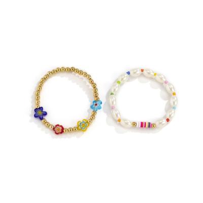 China Simplicity Top Selling Acrylic Female Imitation Pearl Soft Ceramic Braided Colorful Elastic Bracelet for sale