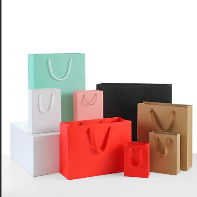 China Recycled Materials Logo Printed Black Cardboard Paper Custom Gift Bag With String For Shopping Apparel Packaging Small Business Bolsa Papel for sale