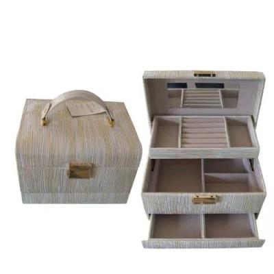 China Custom Multifunctional Three-Layer Leather Jewelry Box Earrings Drawer Style Biodegradable Earrings Lock Jewelry Box Dressing Case for sale