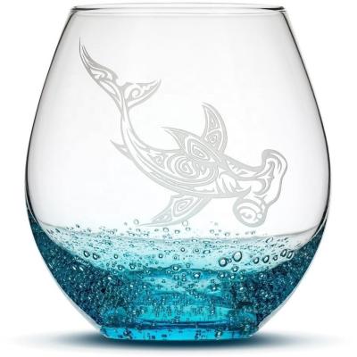 China Classic / Postmodern New Hand Etched Dolphin Shark Design Tribal Sand Cut Sparkling Turquoise Colored Stemless Wine Glass for sale