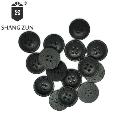 China Fashion resin ox bone resin button 4 buttons wholesale black hole button men's and women's suit jacket for sale