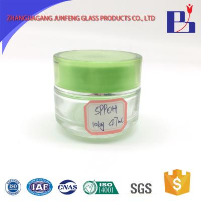 China Personal care junfeng 45ml green tinted sealable cosmetic glass jar 105g for sale