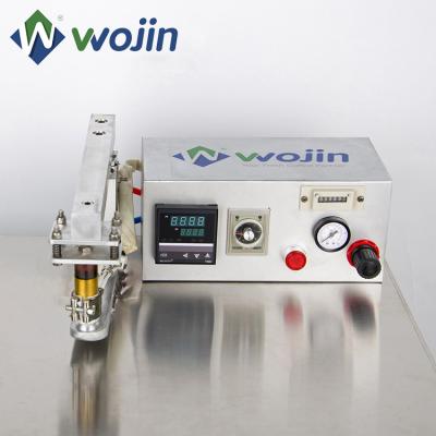 China Food Compound Packaging Soft Valve Applier Semi Automatic Valve Degassing Applicator for sale