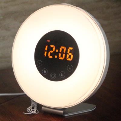 China Sunrise simulation sunrise simulation wake up sunset light sleep FM radio alarm clock nap night dusting light for sale