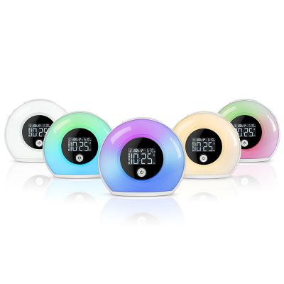 China LUMINOVA Portable Vibration Sensor Alarm Clock Wake Up Light Bluetooth Speaker Colorful Music Player for sale