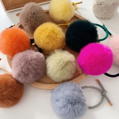 China Environmental Friendly Women Fashion Elastic Hair Bands Ponytail Holders Hair Accessories Pompom Plush Fur Hair Tie for sale