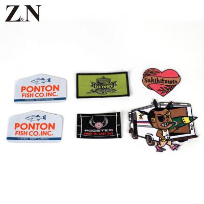 China Custom Made Zeneng Handmade Cheap Price Fabric Iron On Clothing Tag Embroidered Patch for sale