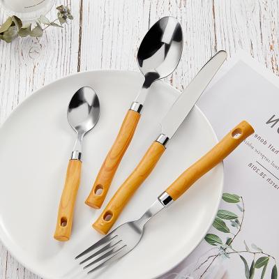 China Viable Imitate Wooden Handle Flatware 24pcs Flatware Silver Plastic Can Match Flatware Rack for sale