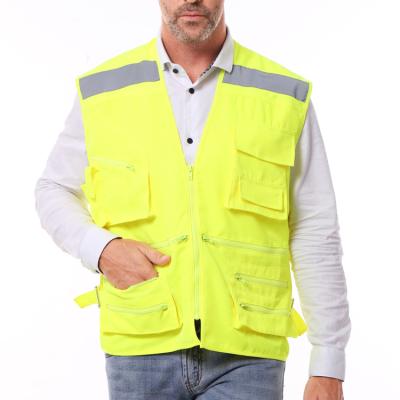 China Men's Multi Pocket ANSI High Visibility Cotton 100% Function 9 Workwear Safety Reflective Vest Hi Viz for sale