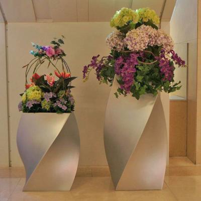 China Indoor Decorative Flower Shape Spiral Flower Shape Decoration Mall Watering Planters Durable Fiberglass Material For Sale for sale