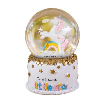 China Resin Snowflake Resin Opens Decoration Ornaments Gift Unicorn Desktop Crystal Ball With Light Music Box for sale