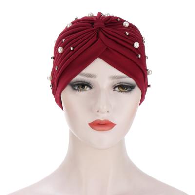 China Comfortable European Fashion Pleated Women Winter Indian Yoga Hat Solid Color Pearl Scarf Durable Muslim Turban Hat for sale