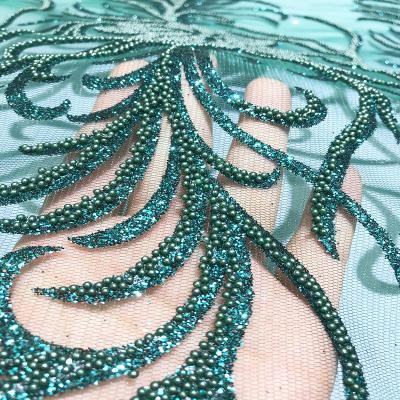 China Viable Newcomer Shiny Bonded Glitter Pearl Sugar Lace Fabric Dress Material in Dark Green for Lady Party Gown Tulle Mesh With Pearl for sale